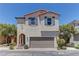 Charming two-story home featuring a spacious two-car garage and desert landscaping at 7104 Flathead River Ave, Las Vegas, NV 89179