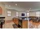 Kitchen featuring a granite countertop island with barstool seating opening up to the living room at 7104 Flathead River Ave, Las Vegas, NV 89179