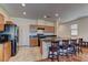 Kitchen featuring a granite countertop island with barstool seating and stainless steel appliances at 7104 Flathead River Ave, Las Vegas, NV 89179