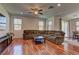 Cozy living room with dark wood floors and a ceiling fan at 7104 Flathead River Ave, Las Vegas, NV 89179