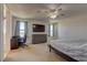 Spacious main bedroom featuring large windows, ceiling fan, and plenty of natural light at 7104 Flathead River Ave, Las Vegas, NV 89179