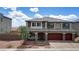 Attractive two-story home with stone accents, three-car garage and desert landscaping at 7255 Bold Rock Ave, Las Vegas, NV 89113