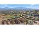 Expansive aerial view of the community, highlighting its proximity to the golf course and scenic mountains at 728 Hardy Way # E, Mesquite, NV 89027