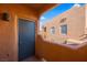 Inviting balcony provides views of the stucco architecture and blue skies of the neighborhood at 728 Hardy Way # E, Mesquite, NV 89027