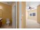 Clean bathroom featuring a vanity, toilet, and access to another room, providing functionality and space in a neutral palette at 728 Hardy Way # E, Mesquite, NV 89027