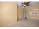 A large bedroom is enhanced by a modern ceiling fan, mirrored closet and neutral carpeting at 728 Hardy Way # E, Mesquite, NV 89027