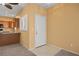 Warm entryway featuring neutral paint, and a view into the kitchen, a welcoming entry to the home at 728 Hardy Way # E, Mesquite, NV 89027