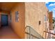 Exterior view highlighting the stucco facade, front door, stairs, and windows of the property at 728 Hardy Way # E, Mesquite, NV 89027