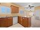 Functional kitchen showcasing wood cabinets, granite countertops, and a convenient layout, perfect for culinary enthusiasts at 728 Hardy Way # E, Mesquite, NV 89027