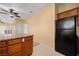 Efficient kitchen space equipped with wood cabinets, granite countertops, and modern appliances, seamlessly integrated for a cohesive appeal at 728 Hardy Way # E, Mesquite, NV 89027
