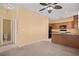 Inviting kitchen and living space with wood cabinets, granite countertops, and a practical layout, perfect for modern living at 728 Hardy Way # E, Mesquite, NV 89027