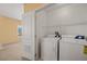 Convenient laundry area with a washer and dryer located off the main bedroom offers storage space above at 728 Hardy Way # E, Mesquite, NV 89027