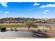 Beautiful homes in a desert neighborhood with a view from a balcony overlooking the street and desert landscape at 728 Hardy Way # E, Mesquite, NV 89027
