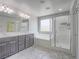 Bright bathroom with double vanity, soaking tub, and separate shower at 7753 Petite Pillar Ct, Las Vegas, NV 89149
