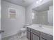 Neutral bathroom with tub, shower, and window for natural light at 7753 Petite Pillar Ct, Las Vegas, NV 89149