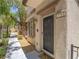 Close up of a townhome front door with a landscaped walkway leading to a welcoming entrance at 7753 Petite Pillar Ct, Las Vegas, NV 89149