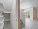 Entryway with stairs and view into dining and patio area at 7753 Petite Pillar Ct, Las Vegas, NV 89149