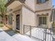 Charming townhome entrance with a private patio, offering a welcoming curb appeal at 7753 Petite Pillar Ct, Las Vegas, NV 89149