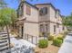 Inviting townhome featuring a cozy front patio area, perfect for outdoor relaxation and enjoyment at 7753 Petite Pillar Ct, Las Vegas, NV 89149