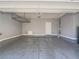 Oversized 2 car garage with epoxy flooring, storage racks, and utility hookups at 7753 Petite Pillar Ct, Las Vegas, NV 89149