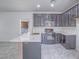Modern kitchen featuring stainless steel appliances and light countertops at 7753 Petite Pillar Ct, Las Vegas, NV 89149