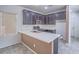 Modern kitchen featuring stainless steel appliances and light countertops at 7753 Petite Pillar Ct, Las Vegas, NV 89149