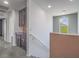 Upstairs landing with cabinets and view to the outside at 7753 Petite Pillar Ct, Las Vegas, NV 89149