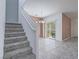 Staircase leading to the second floor with dining and patio area at 7753 Petite Pillar Ct, Las Vegas, NV 89149