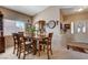 Welcoming dining room with carpet, neutral colors, and a view to the home's entry at 805 Palmero Way, Boulder City, NV 89005