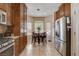 Bright kitchen features stainless steel appliances, tile floors, and an adjacent dining area at 805 Palmero Way, Boulder City, NV 89005