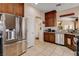 Kitchen featuring stainless steel refrigerator and views into the living spaces at 805 Palmero Way, Boulder City, NV 89005