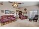 Spacious living room featuring a comfortable seating arrangement and access to the outdoor area at 805 Palmero Way, Boulder City, NV 89005