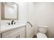 Powder room featuring modern fixtures, a sleek vanity, and an accessible handrail at 831 E Valiant Ave, Pahrump, NV 89060