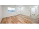 Spacious living room with wood-look flooring and natural light at 831 E Valiant Ave, Pahrump, NV 89060