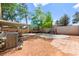 Large backyard with a covered patio, play structure, and ample space for Gathering activities at 8505 Lansdale Rd, Las Vegas, NV 89123