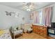 Bedroom with bright decor, a crib and plenty of natural light at 8505 Lansdale Rd, Las Vegas, NV 89123
