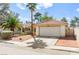 Charming single-story home featuring desert landscaping, a tile roof, and an attached two-car garage at 8505 Lansdale Rd, Las Vegas, NV 89123