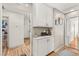 Bright hallway featuring built-in storage cabinets and hardwood floors at 8505 Lansdale Rd, Las Vegas, NV 89123