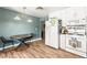 Bright kitchen featuring white cabinetry, stainless steel appliances, and a cozy dining area at 8505 Lansdale Rd, Las Vegas, NV 89123