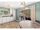 Bright kitchen featuring white cabinets, modern appliances, and a view of the backyard patio at 8505 Lansdale Rd, Las Vegas, NV 89123