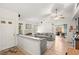 Comfortable living room with a brick fireplace, wood floors, and modern decor at 8505 Lansdale Rd, Las Vegas, NV 89123