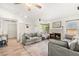 Comfortable living room with a brick fireplace, wood floors, and modern decor at 8505 Lansdale Rd, Las Vegas, NV 89123