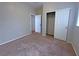Comfortable bedroom with carpeted floors and a closet with sliding doors, providing ample storage space at 9034 Grenache St, Las Vegas, NV 89148