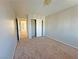 Bedroom featuring carpeted floors, neutral-colored walls, and a closet with sliding doors at 9034 Grenache St, Las Vegas, NV 89148