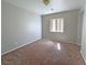 Cozy bedroom with neutral walls and carpeting; window provides natural light at 9034 Grenache St, Las Vegas, NV 89148