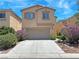 Charming two-story home with a two-car garage and landscaped front yard. The house number is 9034 at 9034 Grenache St, Las Vegas, NV 89148