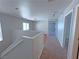 Upstairs hallway that leads to the bedrooms featuring plush carpet, neutral walls and a staircase to downstairs at 9034 Grenache St, Las Vegas, NV 89148