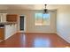 Bright living room featuring hardwood floors, a ceiling fan and large windows for optimal natural light at 9034 Grenache St, Las Vegas, NV 89148