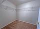 Spacious walk-in closet with carpet floors and wire shelving for maximum storage at 9034 Grenache St, Las Vegas, NV 89148