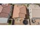 Birds eye view of backyard with trampoline and of neighborhood homes with tile roofs at 9039 Alex Creek Ave, Las Vegas, NV 89149